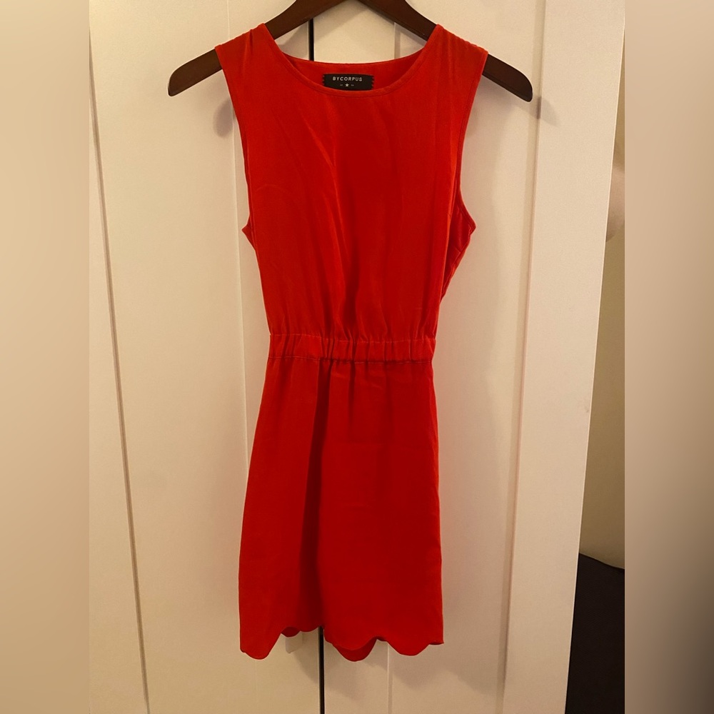Bright red mini dress with delicate scallop trim detailing
